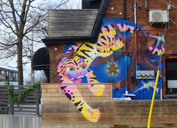 mural of a tiger on the side of a house