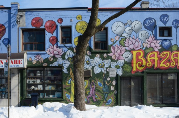 mural by Jim Bravo on Ashdale in Little India with the word Bazaar (as in Little India Bazaar), flowers and people holding balloons