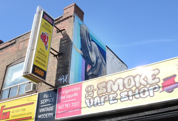 mural of an elephant on the upper level of a store