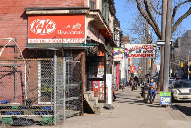 Boston Discount Store with its red and white kit kat advert on sign, on Queen Street East