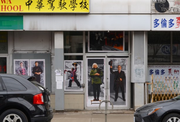 Chinatown poster series on residents, in windows and door on Dundas