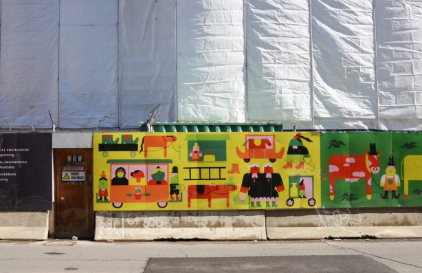 pictures painted on hoardings around building