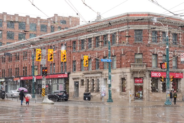 northeast corner of Spadina and Queen in a snow flurry, 