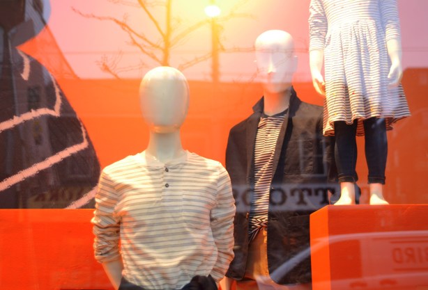 mannequins in Joe Fresh window, orange background, kids clothes