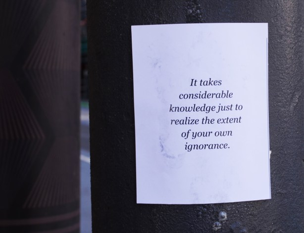 text graffiti on white paper pasteup