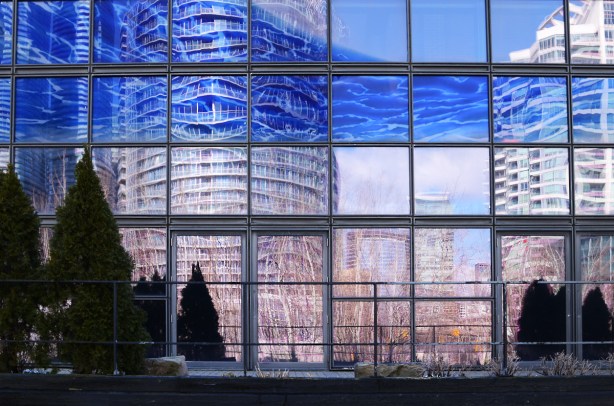 reflections of Canada Square in the glass of the north wall of the Power PLant 