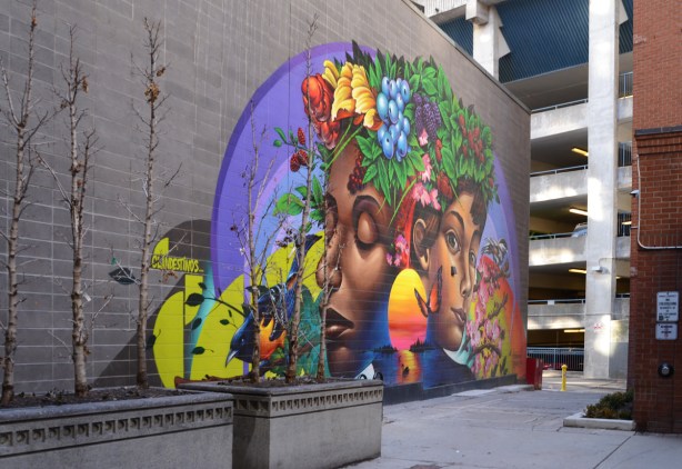 mural by Shalak Attack and Bruno Smoky in a narrow passageway