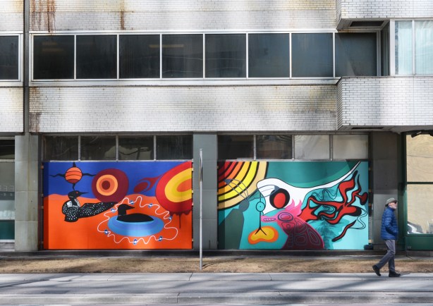 two Indigenous themed murals on exterior walls of Redpath Sugar on Queens Quay