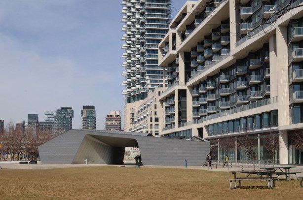 Sherbourne Commons as seen from the waterfront, large grey building with washrooms and change rooms