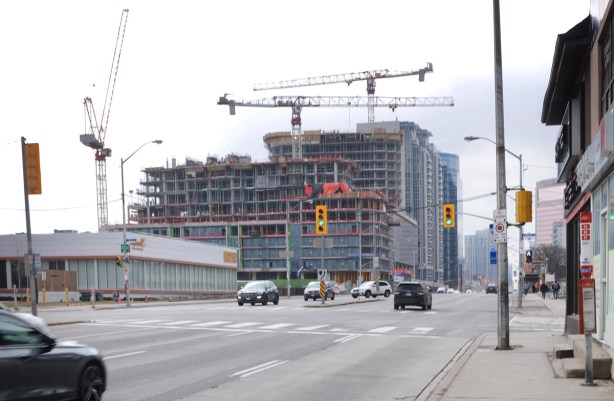 yonge street, looking south from drewry and cummer, large new condo development with 3 cranes, some traffic, 