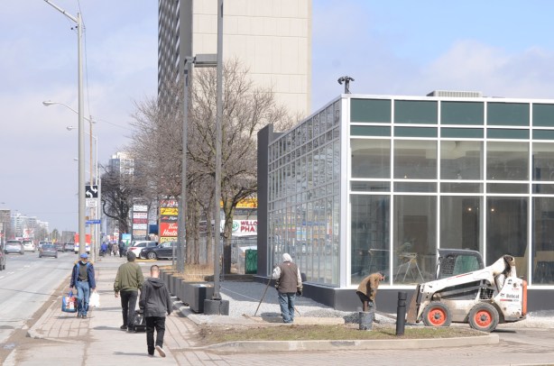 cleaning up in front of a new building on yonge street