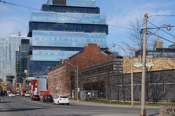 where Eastern Ave meets Front Street, old historic brick building with new glass commercial building behind