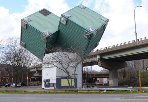 house with two green cube shapes on point