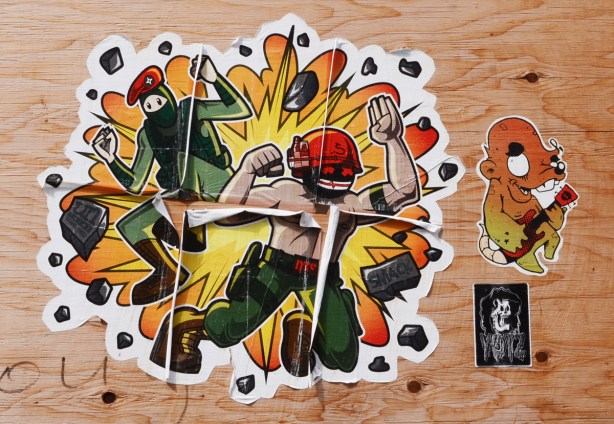 paper paste up urban ninja squadron graffiti on plywood