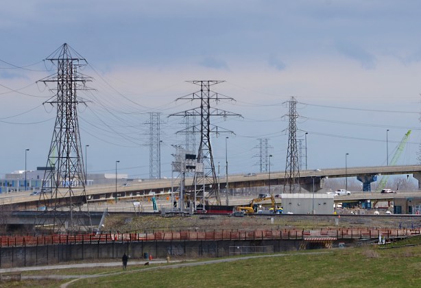 view from south side of Eastern Ave looking east over Don River, ramp from Gardiner to DVP, many tall hydro transmission towers