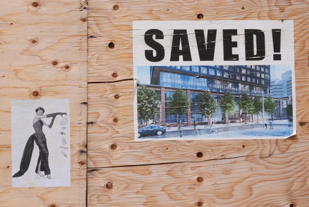 poster on plywood, saved the foundry, also wallflower33 graffiti of well dressed woman scattering pieces of paper that say bye bye to Doug Ford