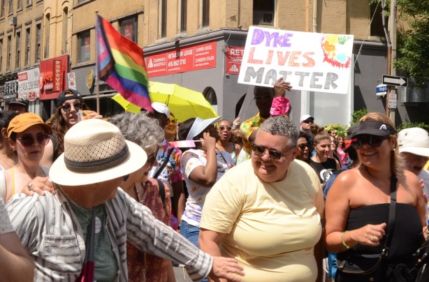 placard that says dyke lives matter
