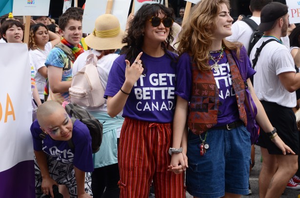 it gets better canada on purple t shirts, holding hands, people, pride parade