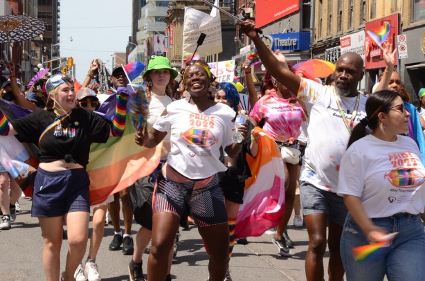women dancing and marching in dyke march