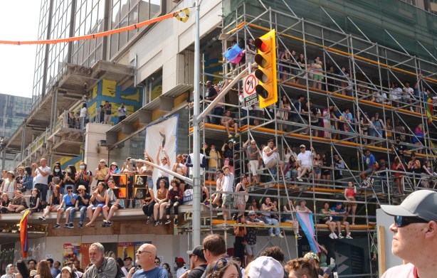 crowds on scaffolding, many levels up, at Yonge and Bloor