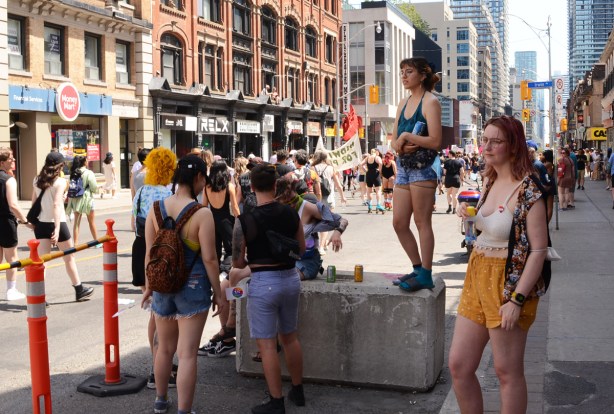 people watching dyke march on yonge street
