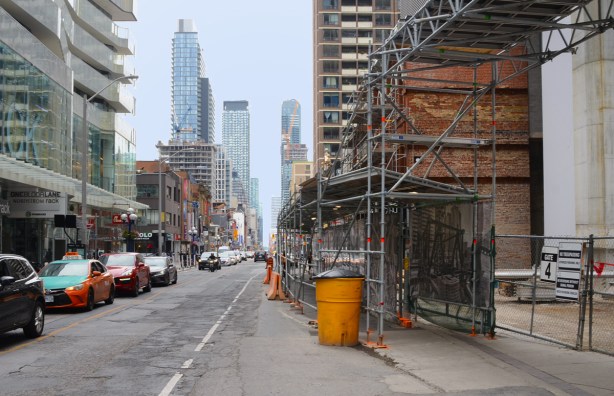 looking south on Yonge from Bloor, construction on west side, new building on east