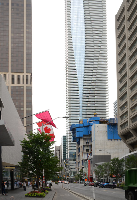 looking west on Bloor towards Yonge, front of Holt Renfrew Store, new tall building at 1 Bloor East
