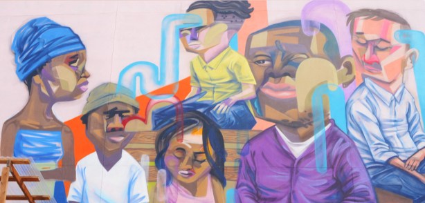 part of a mural by elicser elliot showing the heads of a group of people