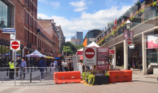 road closed sign, orange barricades, at the south end of Market Street to make it closed to traffic, and open to pedestrians only 
