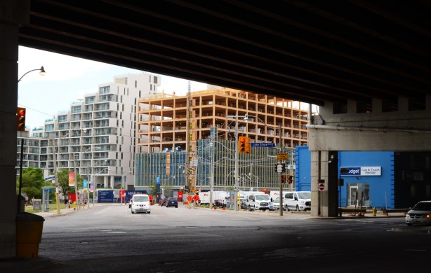 looking south under Gardiner Expressway across Lakeshore Blvd at the end of Parliment where it turns into Queens Quay East 