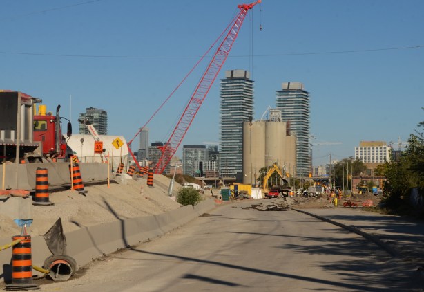port lands construction site, starting to tear up the old part of Cherry Street, distillery district condos in the background 