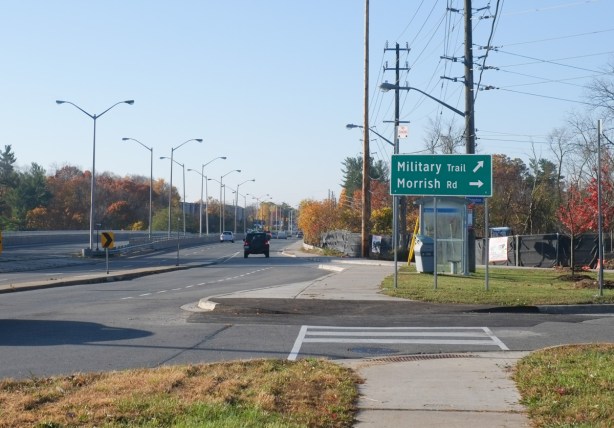 intersection of Kingston Rd., Military Trail, and Morrish Rd, large wide roads, one sign, low traffic levels, sidewalks, no people
