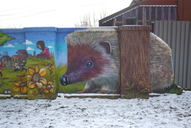 large hedgehog in a mural, painted by Nick Sweetman