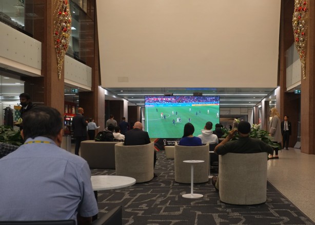 people watching a large tv screen, world cup soccer, football, game, 