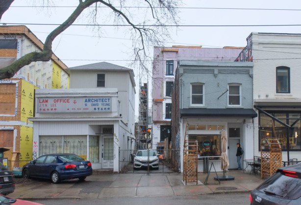 construction infill on Gerrard, building behind the stores, 