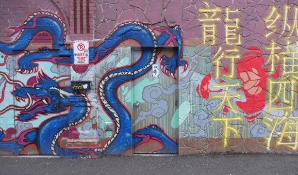 blue dragon, part of a larger mural in chinatown with three dragons