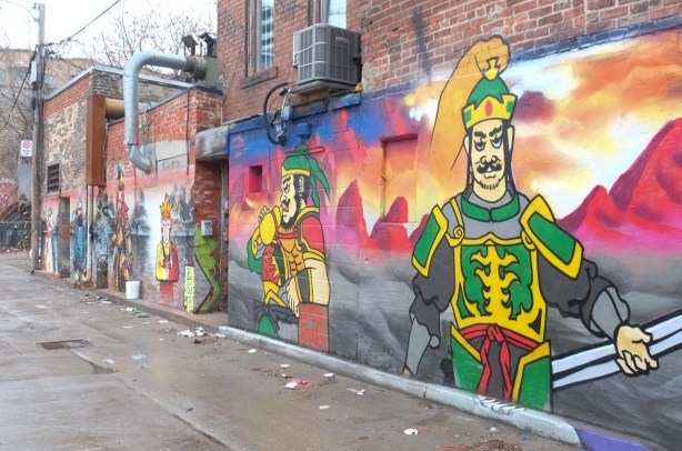 green clad warrior in chinatown mural