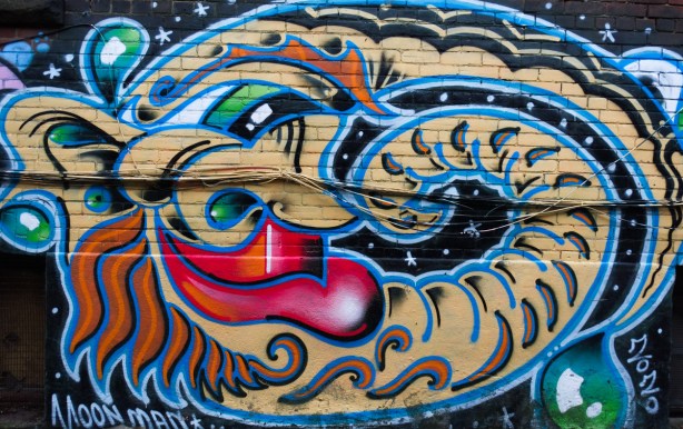 mural by moonman painted in 2020, a snake-like character 