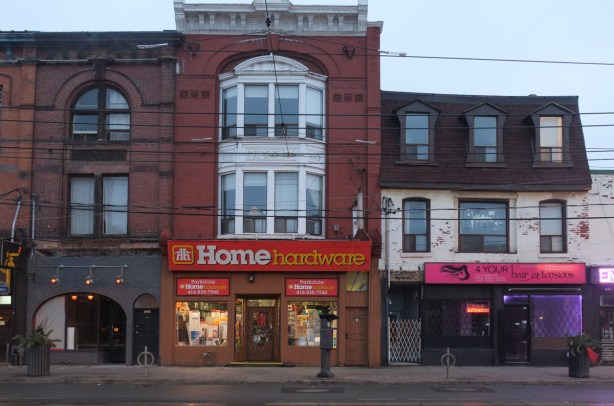 old brick buildings on Queen St West in Parkdale including home hardware store 