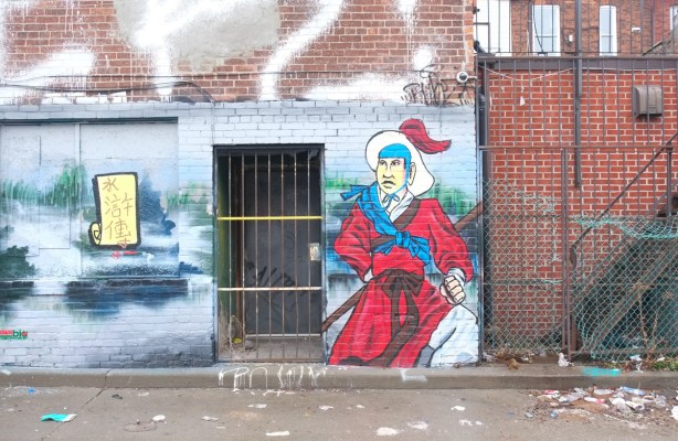 mural with Chinatown theme, man in red robes