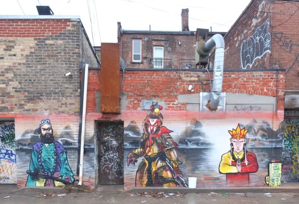 three characters in chinese mural in an alley, warrior, 