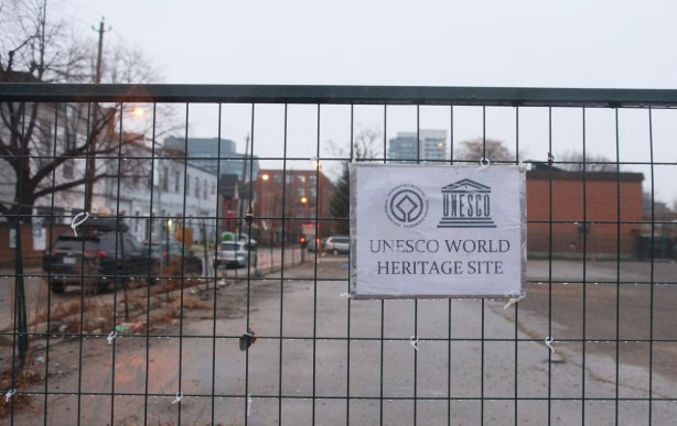 unesco world heritage site sign, on installation of parkdale provincial park, on brock ave, vacant lot where LCBO building was torn down