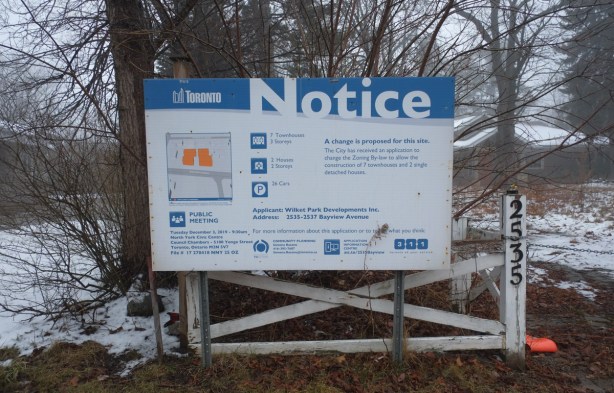 blue and white development notice sign for wilket park developments to demolish house and rebuild townhouses on the lot 