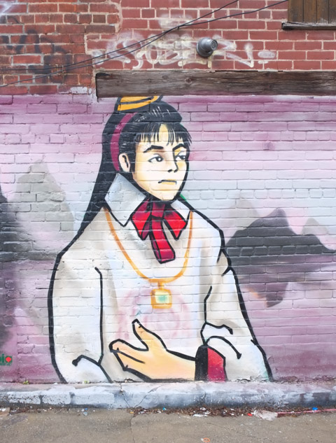young man in chinatown mural