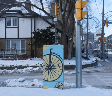 sidewalk box painted with image of old fashioned bicycle