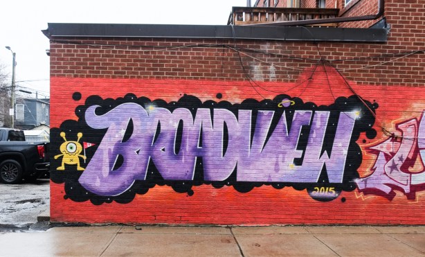 mural, purple letters on black and orange background, word says broadview