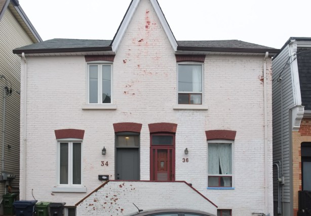 white two storey plain semi house with shared central peak