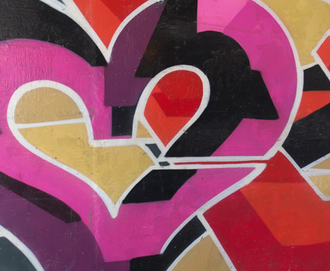 part of a mural by Que Rock, a pink and purple heart
