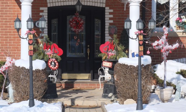 entrance to house, front door, decorated for valentines day, red hearts, love words