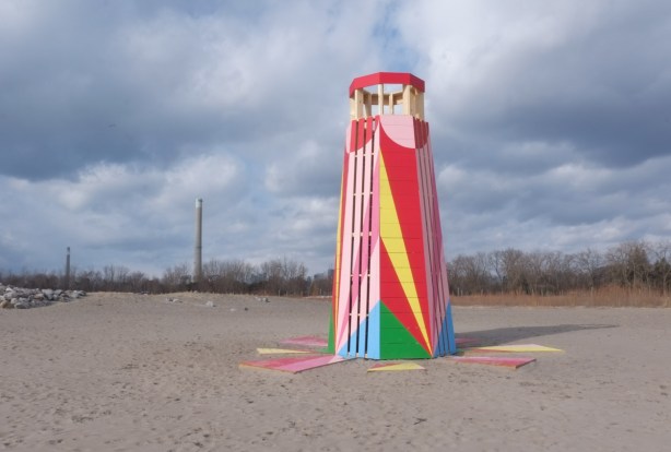 winter stations installation at Woodbine Beach, multicoloured wood lighthouse shaped structure
